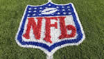 NFL logo painted on the grass on a football field - taken from http://guardianlv.com/2013/09/nfls-magnificent-7-undefeated-at-3-0/